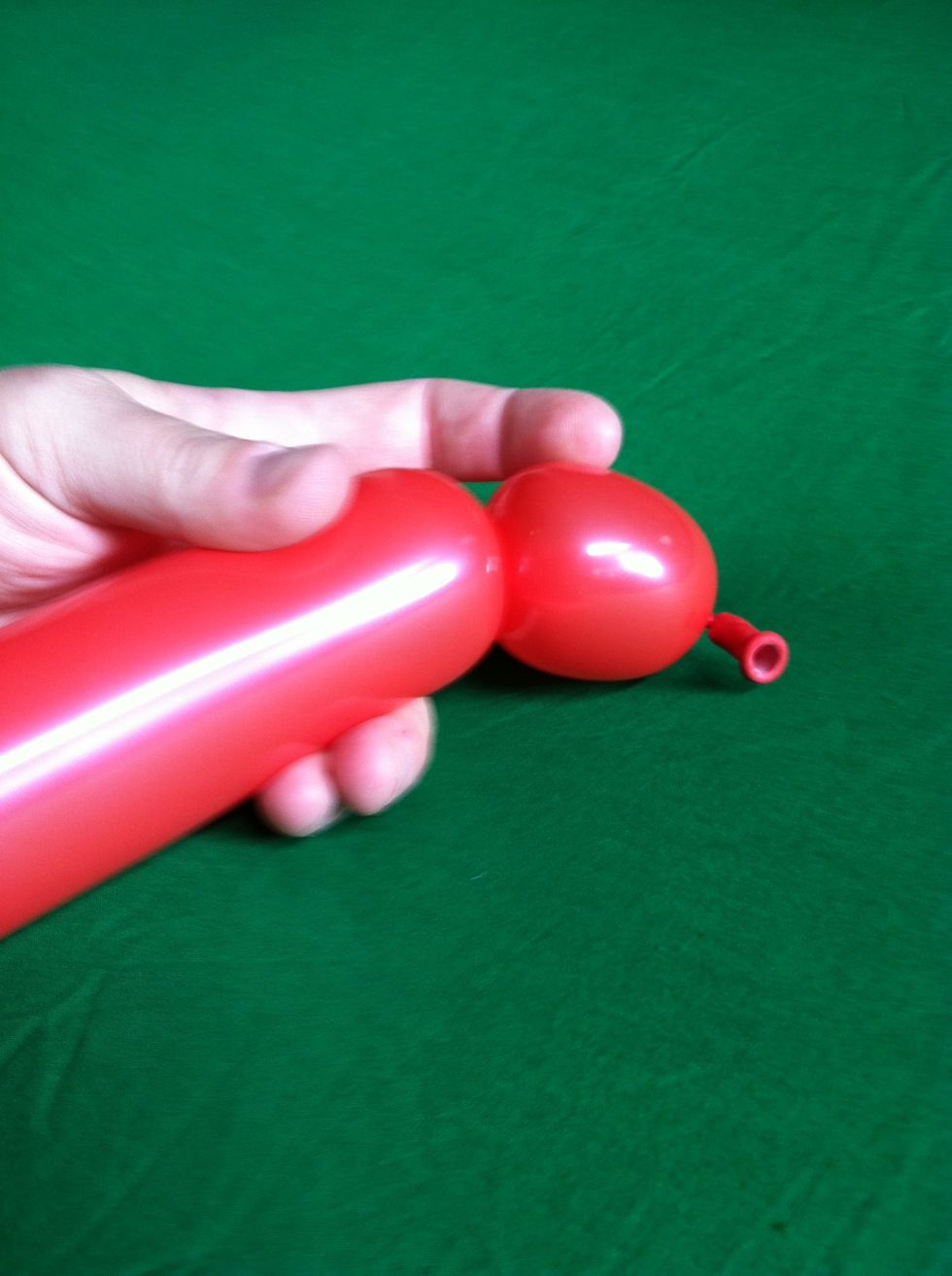 Next lets look at some building blocks or typical bubble types.  First of all, always start twisting on the nozzle side of the balloon so the air can move.  This is a typical bubble twist