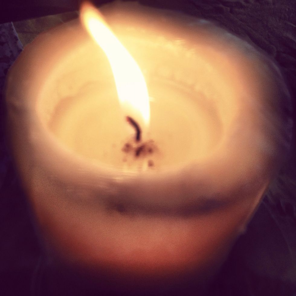 Next, light. It always adds a new kind of magic to photos of you include the sun or a Strong light source. This can change the shot completely. See how the flame makes the background look dark.