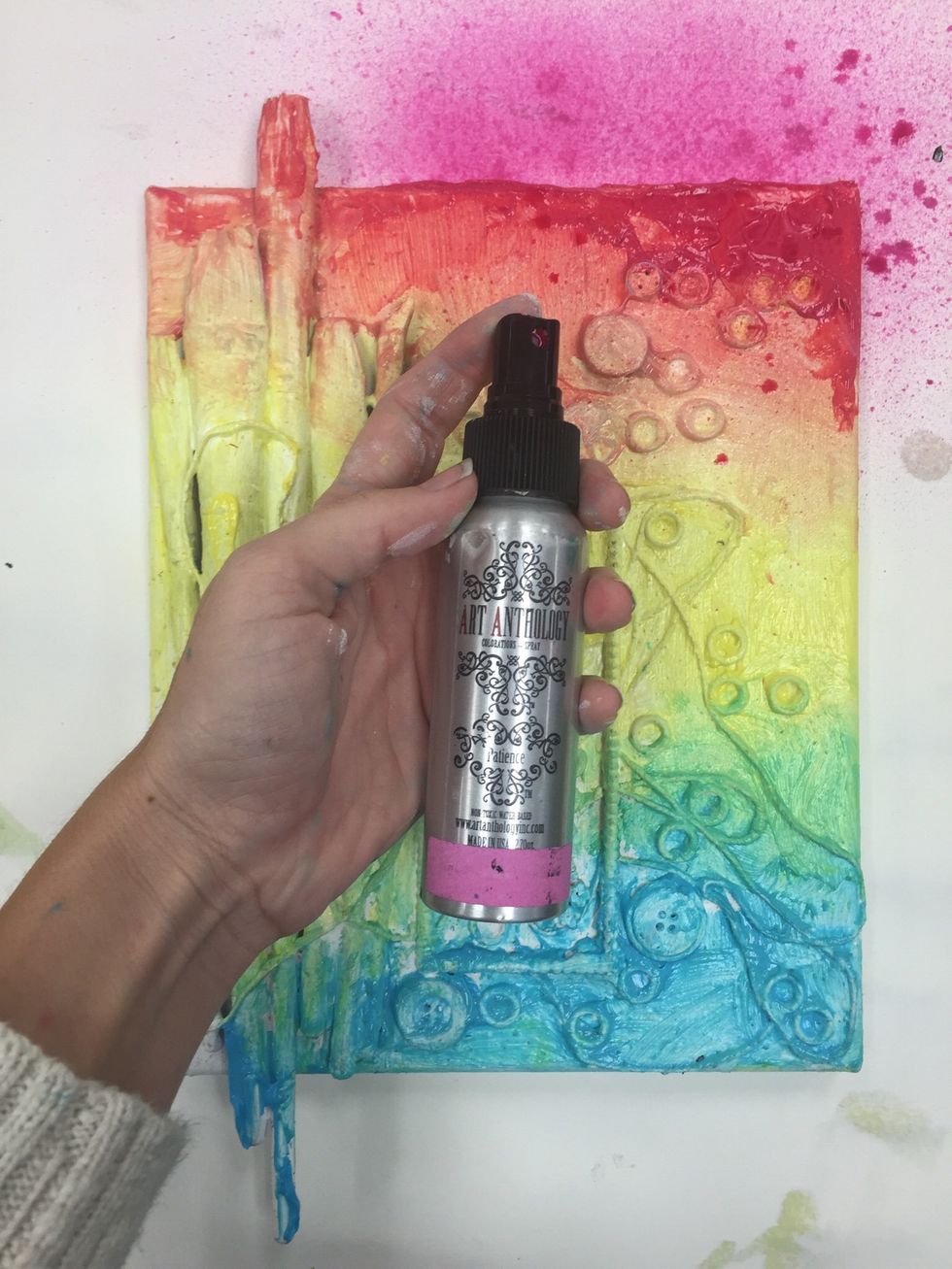 Next lightly spray Art Anthology's Coloration Spray in Patience to top of canvas.