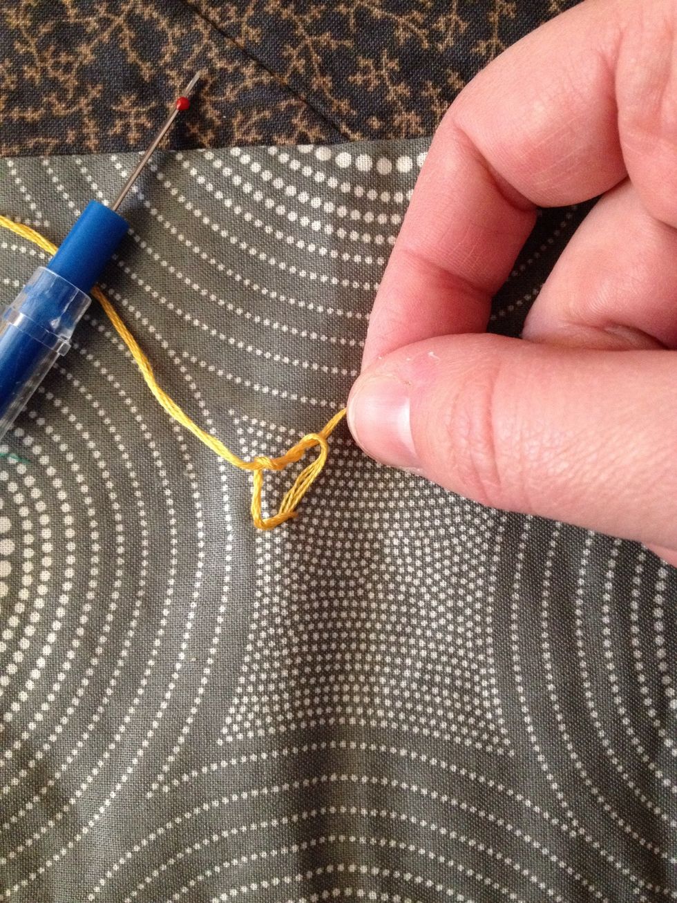 Next, loop over twice--this is the step that secures the knot tight so it won't unravel.