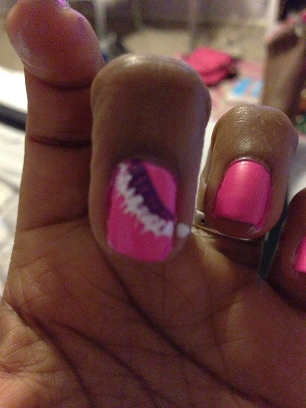 Next make a half circle outlining the first one, and use the straight pin to drag the nail polish down.