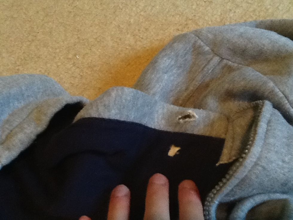 Next make two similar cuts, just like the ones we did earlier on the other side of the sweatshirt