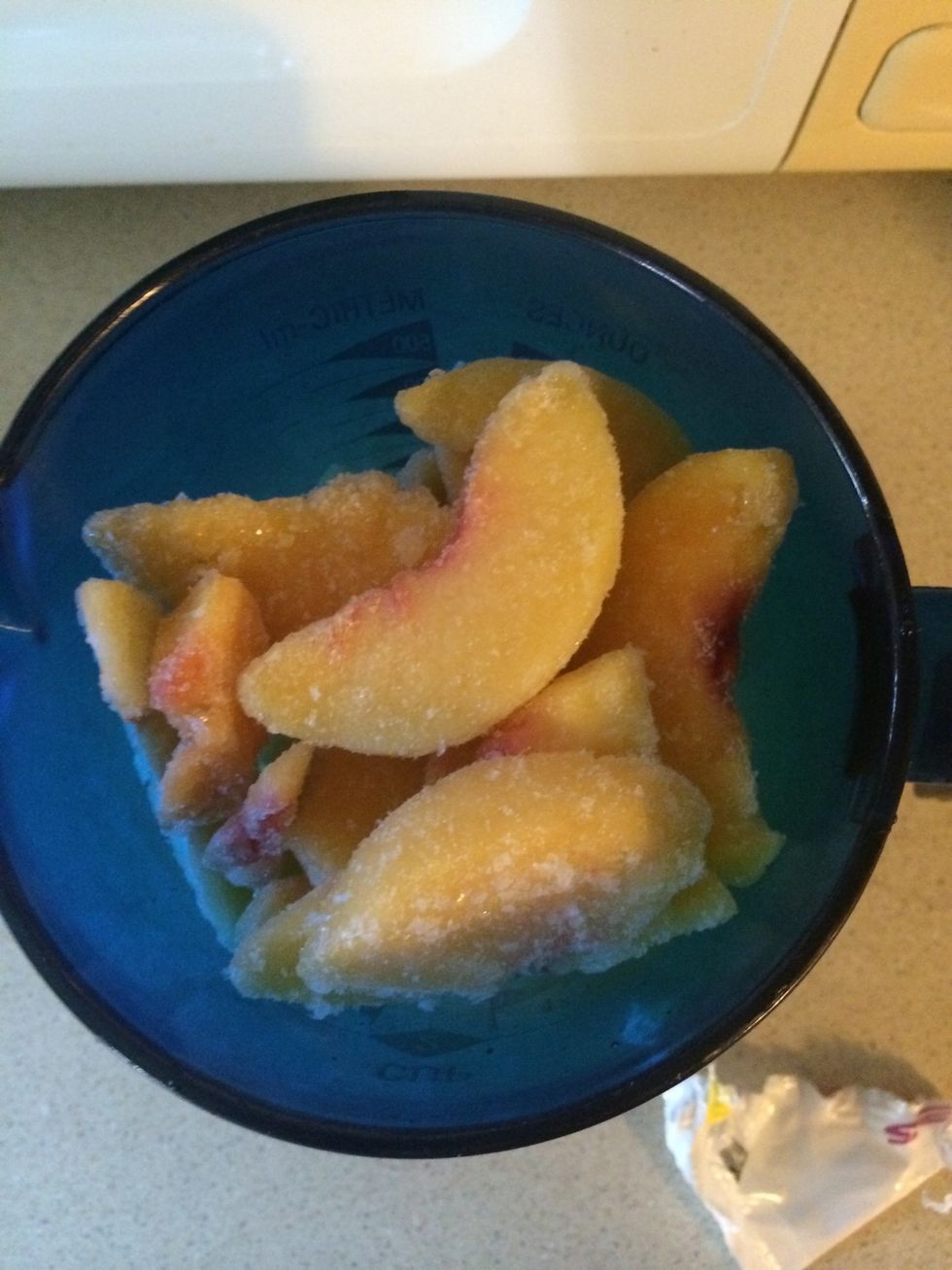 Next measure 2 cups of frozen peaches