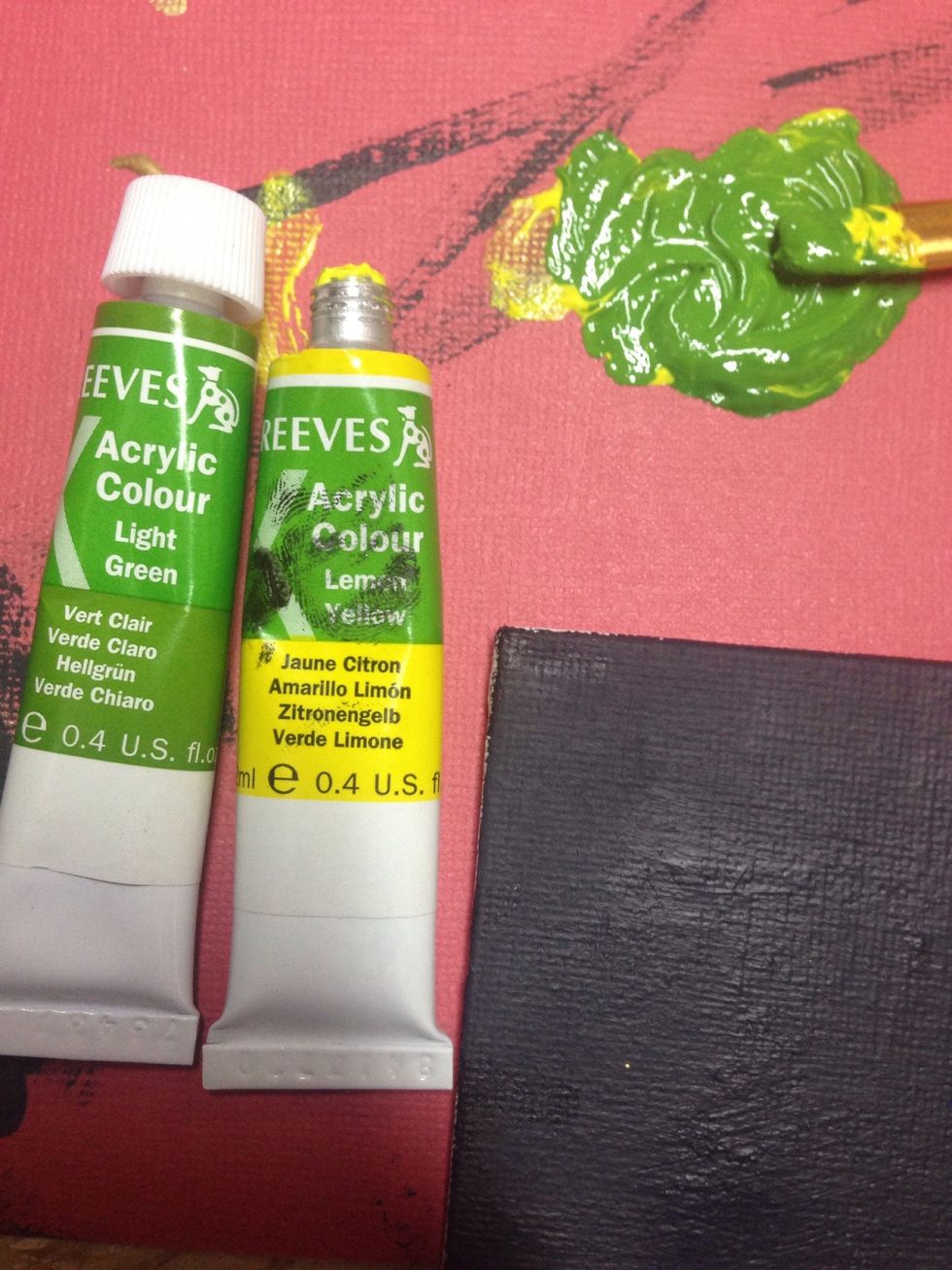 Next, mix green and yellow paint to reach the desired color for his eyes