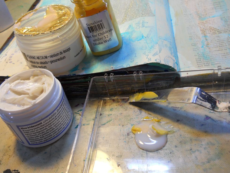 Next mix some AA "Sunshine" ,AA "Gold" and pouring medium, this will be called the "Beeswax mixture" from here on out. Paint this mixture over the surface and allow to dry.(or you can use a heat tool.