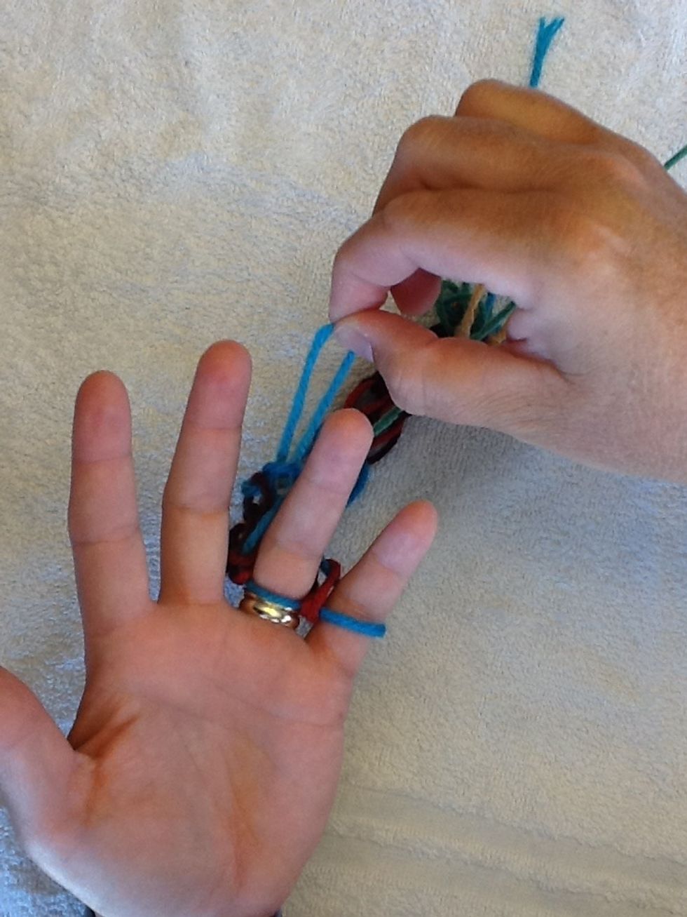 Next move middle finger loop over to the ring finger.