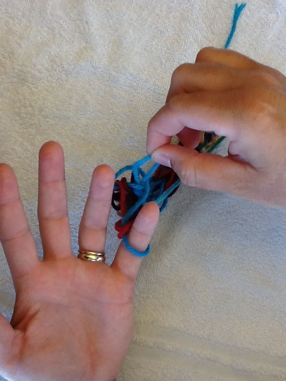 Next, move ring finger loop over to pinky finger.