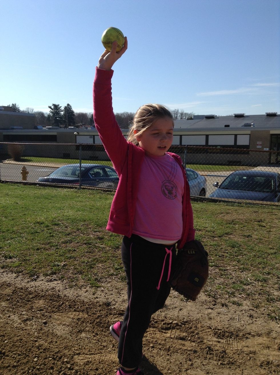 Next, move your arm up like a windmill.