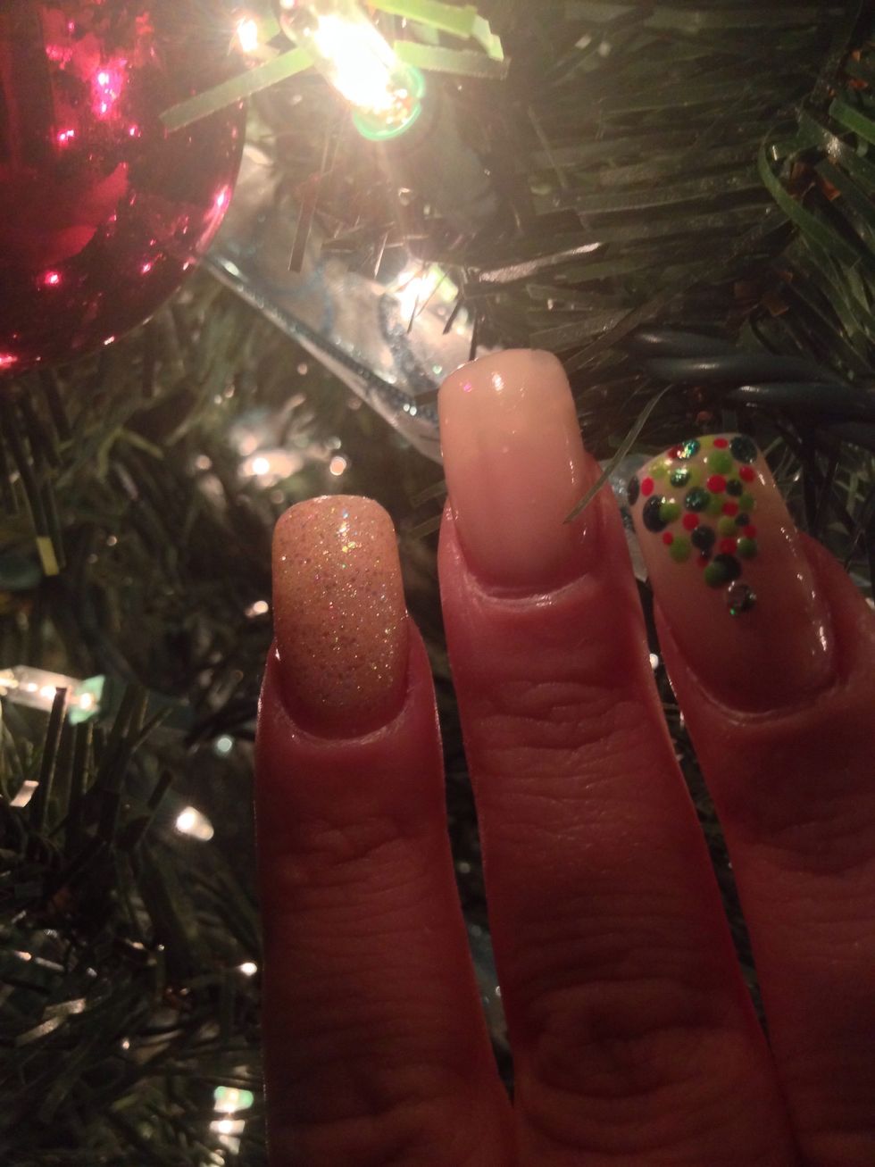 Next paint a nail with a sparkly gold or red polish.