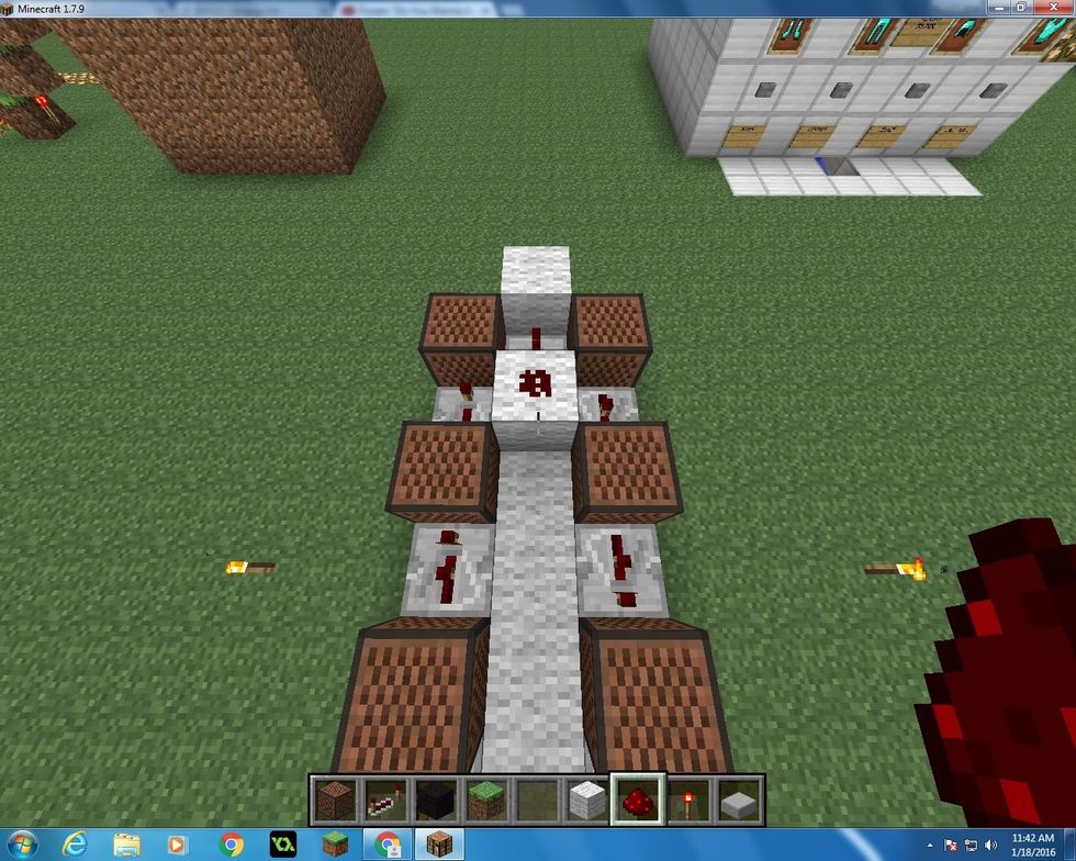 Next place another block of Wool in front of the Repeater you juts put in, and put one Redstone on top of it.