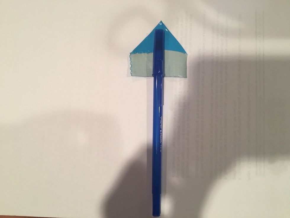 next place the sticky part of the tape where you want to start your flower