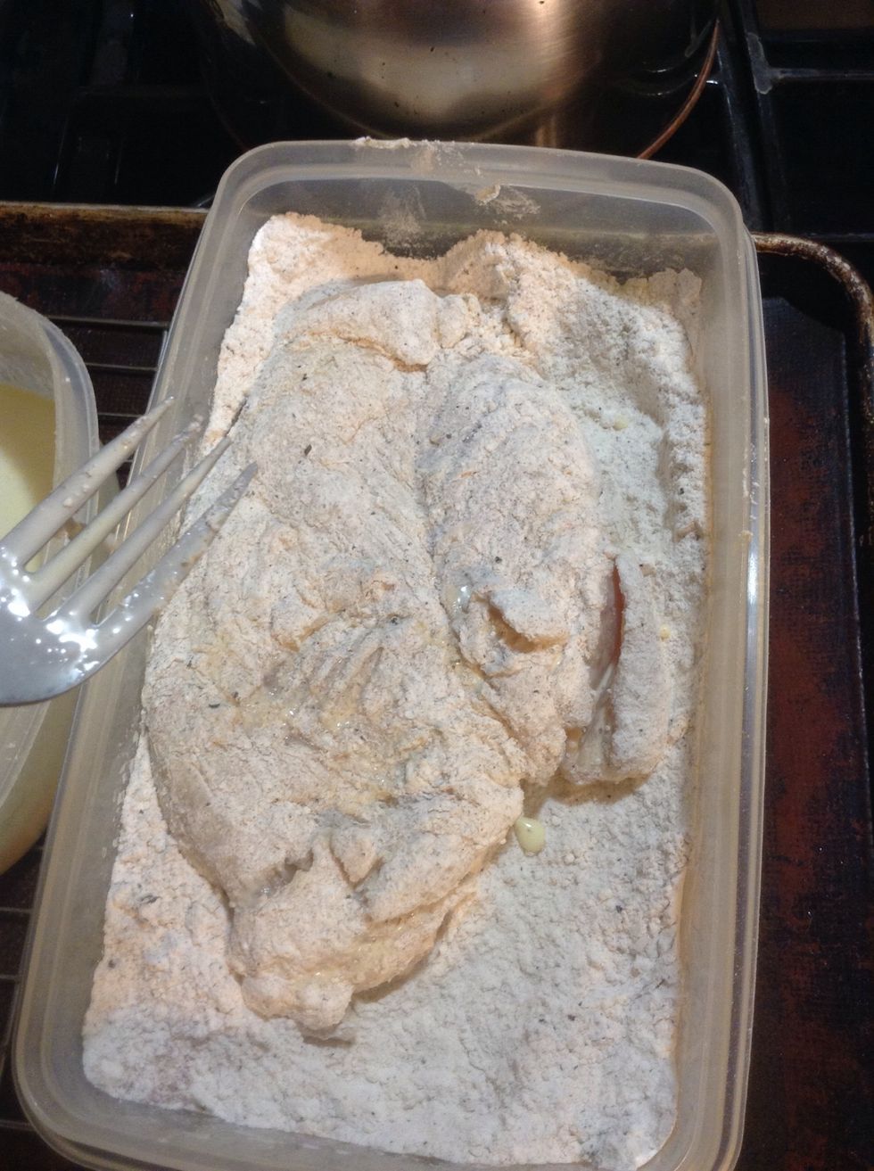 Next place your chicken in the dry ingredients and coat both side well.