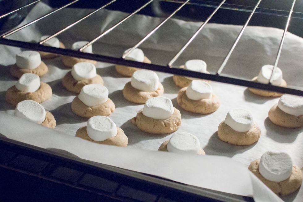 Next, place your cookies once again into the oven until the marshmallows puff up (approximately 3 minutes).