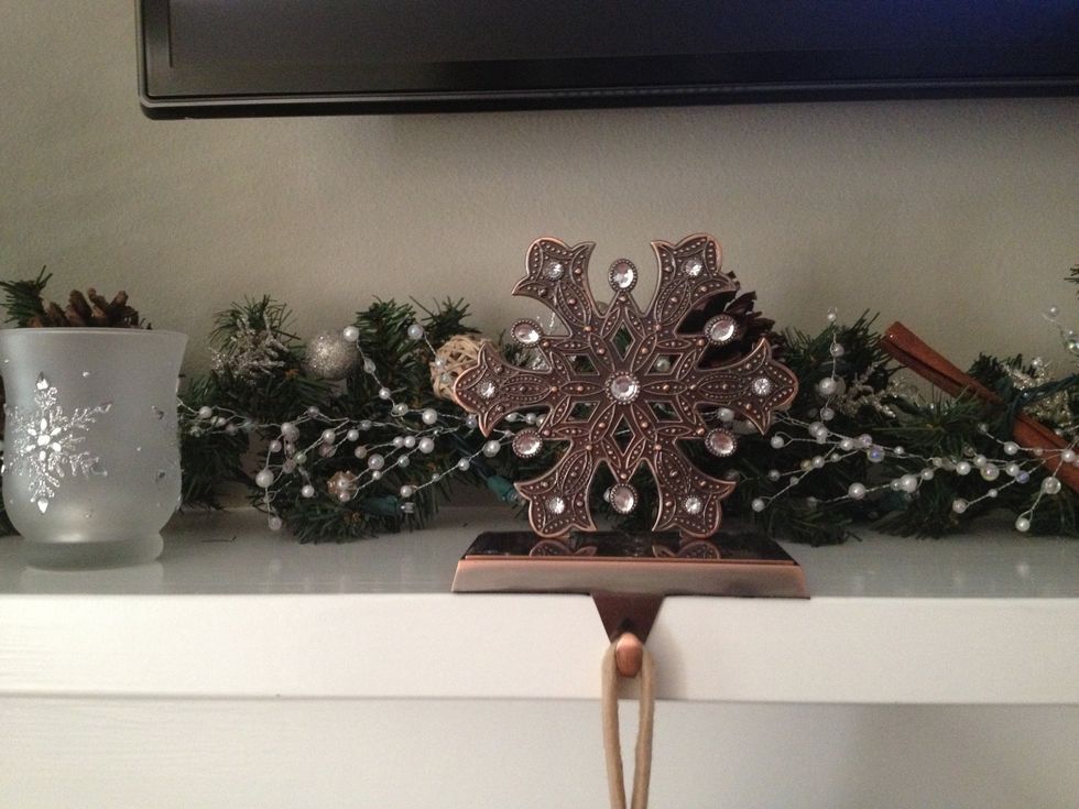 Next, place your stocking holders and stockings on the mantle.