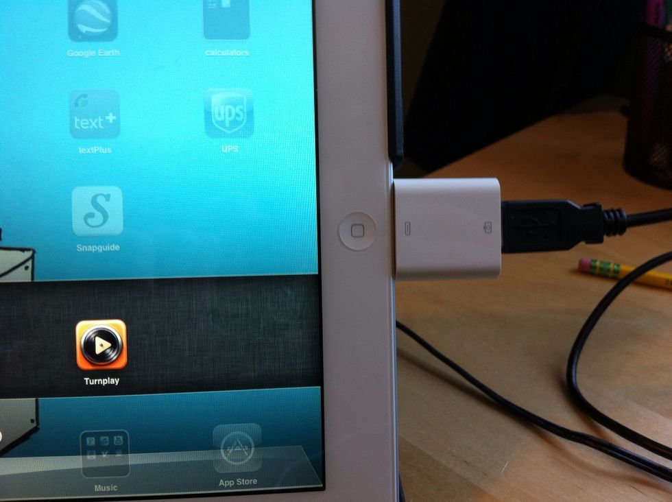 Next: Plug camera connection kit into iPad