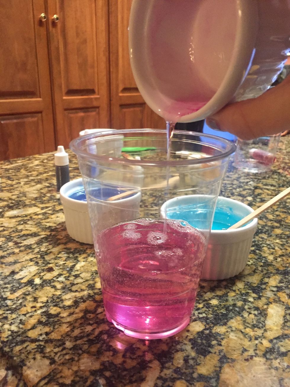 Next, pour all the bowls of soap into one clear cup.