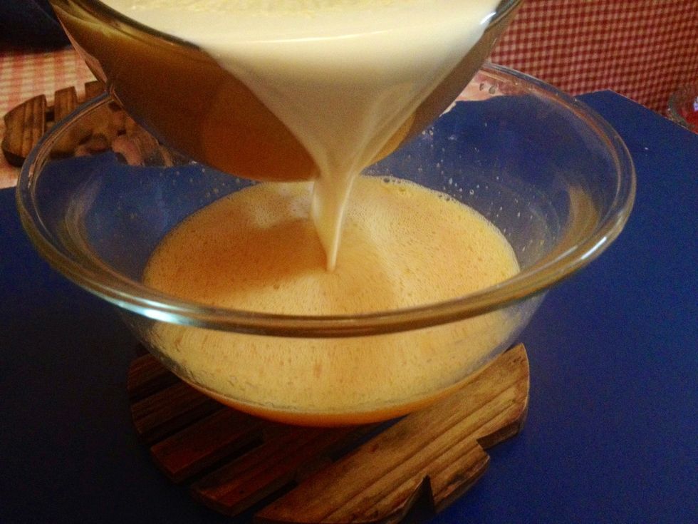 Next, pour and tamper heated milk into egg mixture. By tampering, egg lumps are prevented in preparation. You may also use a strainer to strain any possible insolubles in milk while pouring. I didn't.