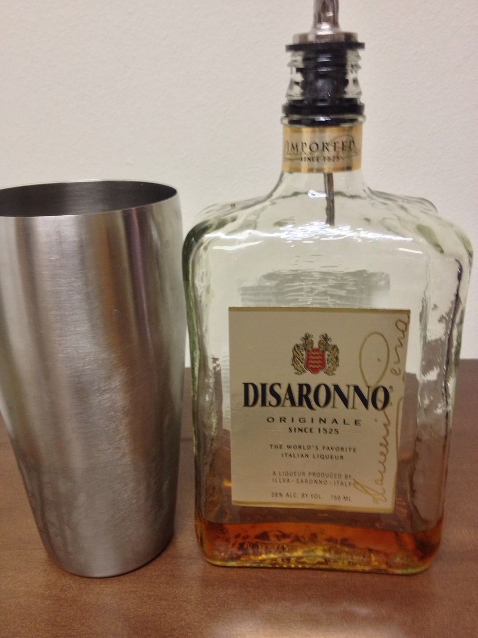 Next, pour in an ounce of your favorite Amaretto liqueur into the S/S.