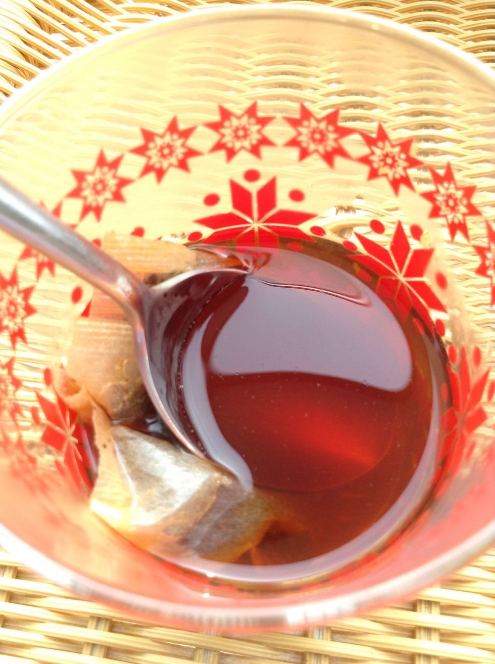 Next, pour more hot water into the cup( half cup full).