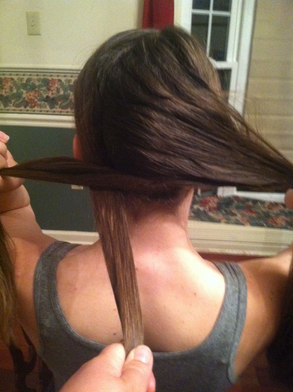 Next pull the left piece of hair behind the right and middle pieces\ud83c\udf6d