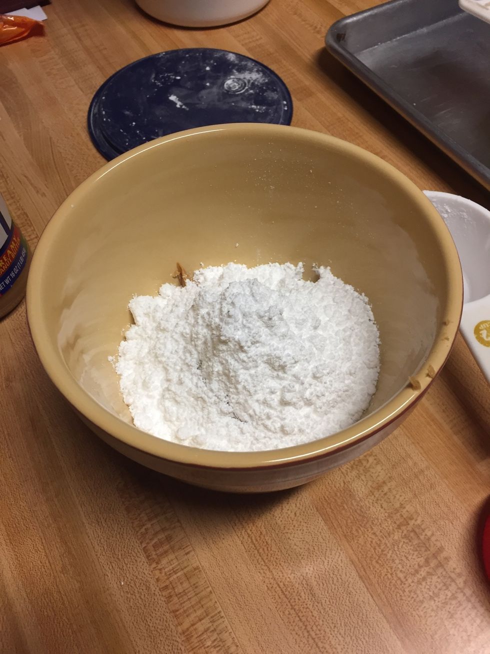 Next, put 2 1/2 cups of powered sugar into the bowl.