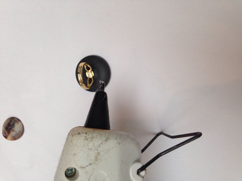 Next put a dab of glue on the flat part of your ring.