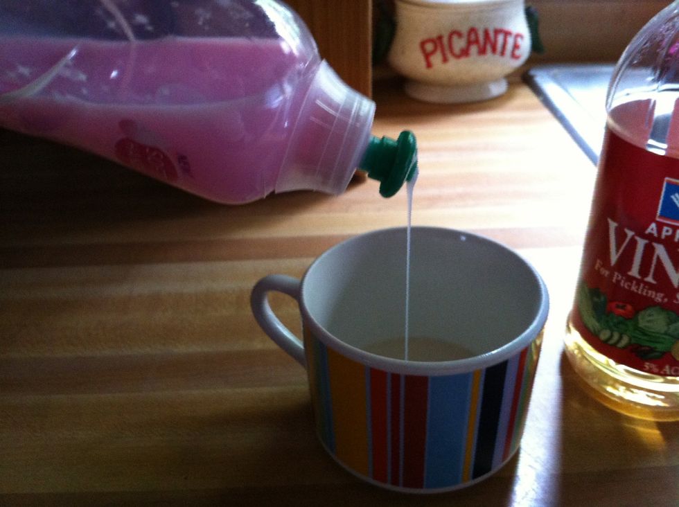Next, put a drop of liquid dish soap in the vinegar. Literally a drop, and do not stir. You can use any brand dish soap.