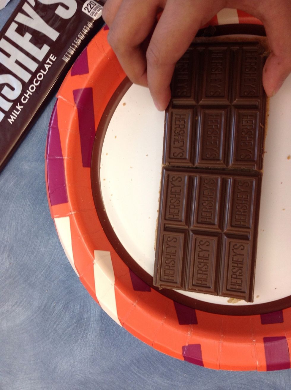 Next, put chocolate on the graham cracker.