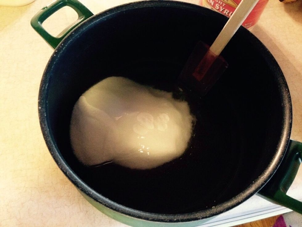 Next put in 1 cup of sugar, then pour in 1 cup of corn syrup