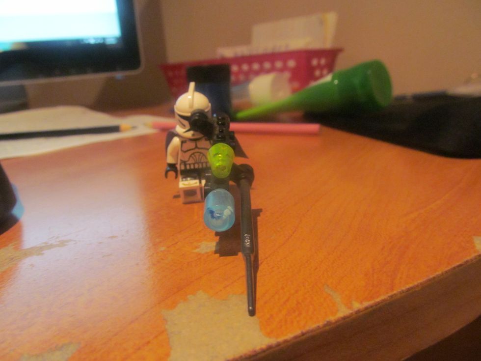 Next put the gun in the guy's hand.