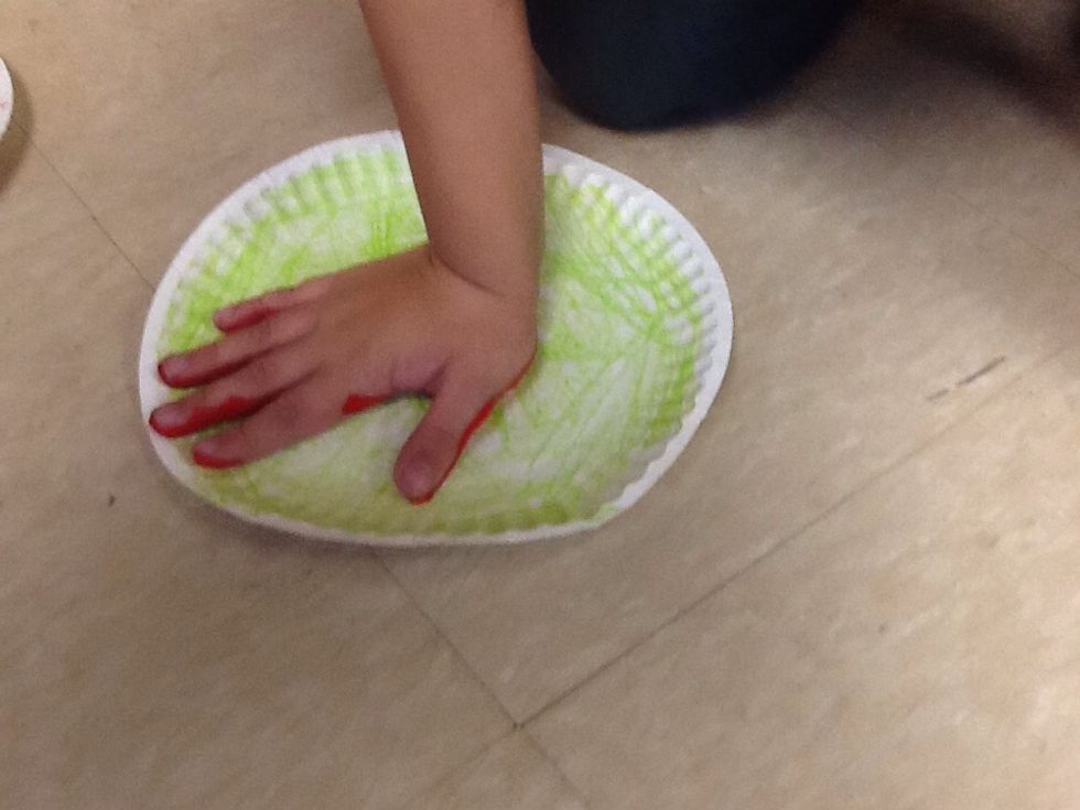Next, put your hand on the plate to make a handprint.