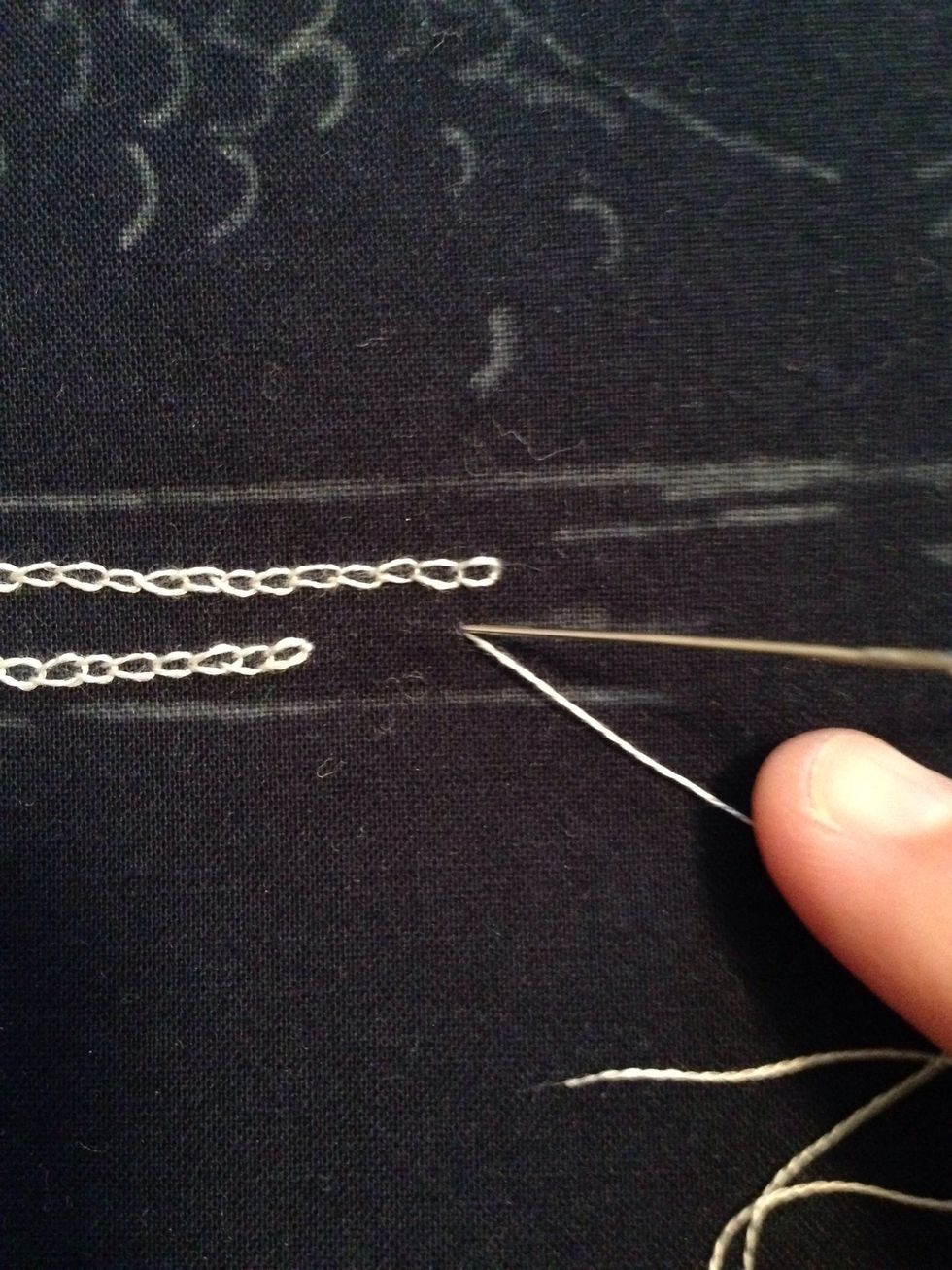 Next reinsert your needle back through the point of entry.