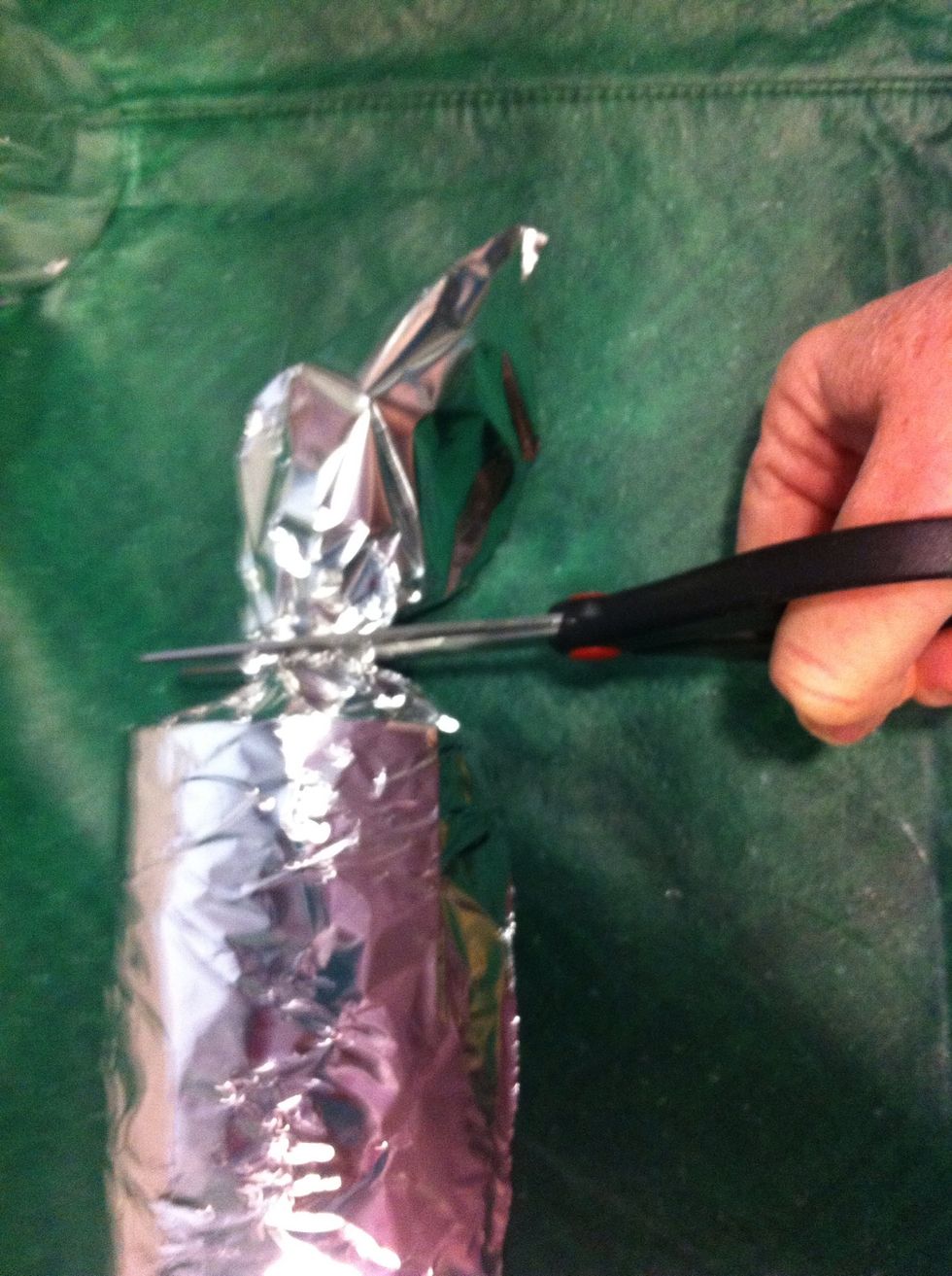 NEXT. Roll all the cans in foil to cover the labels and make them look like bleacher risers. Trim off ends so there isn't so much bulk and the cans set level.