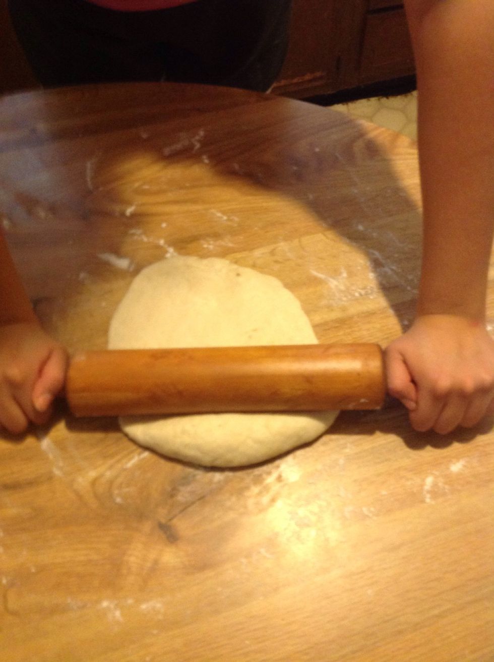 Next- roll out the dough and with a cup make circles on it