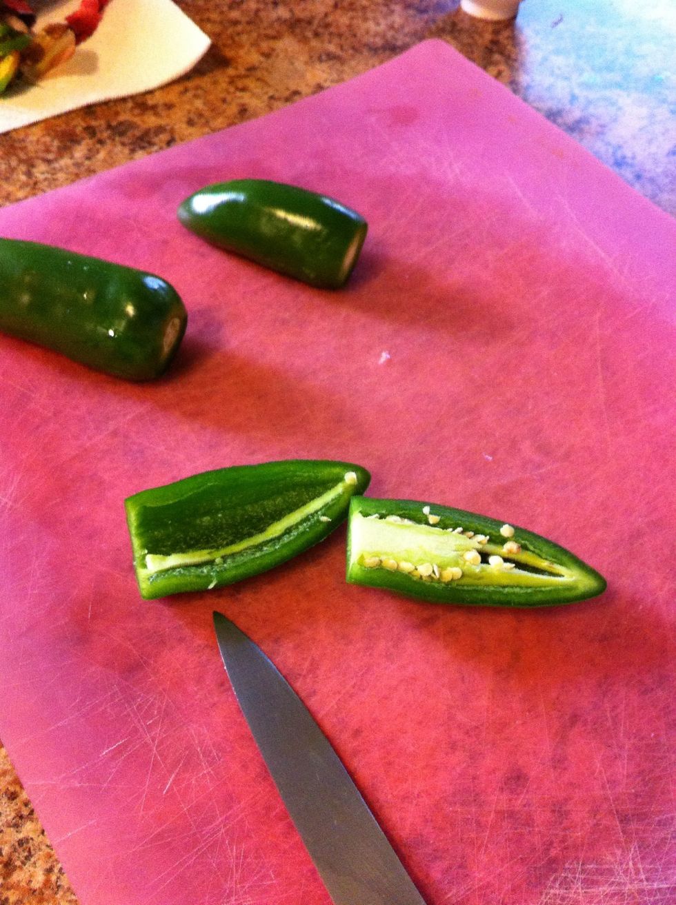 Next seed and mince your jalepe\u00f1os. Be careful not to rub your face or eyes during this process as the jalape\u00f1o juices can be quite uncomfortable on those areas.