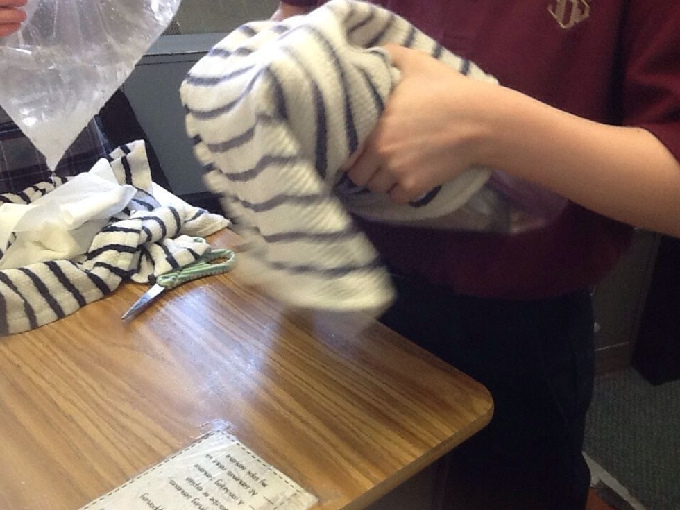 Next, shake the bag continually for 10-15 minutes. Keep shaking until the liquid turns into solid ice cream.