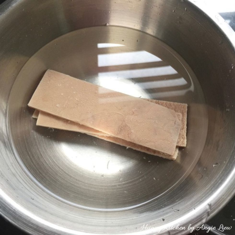 Next, soak dried sweet beancurd sheets in cold water till slightly softened.