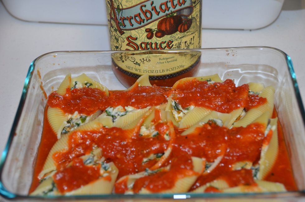 Next spread some arrabiata on the shells.