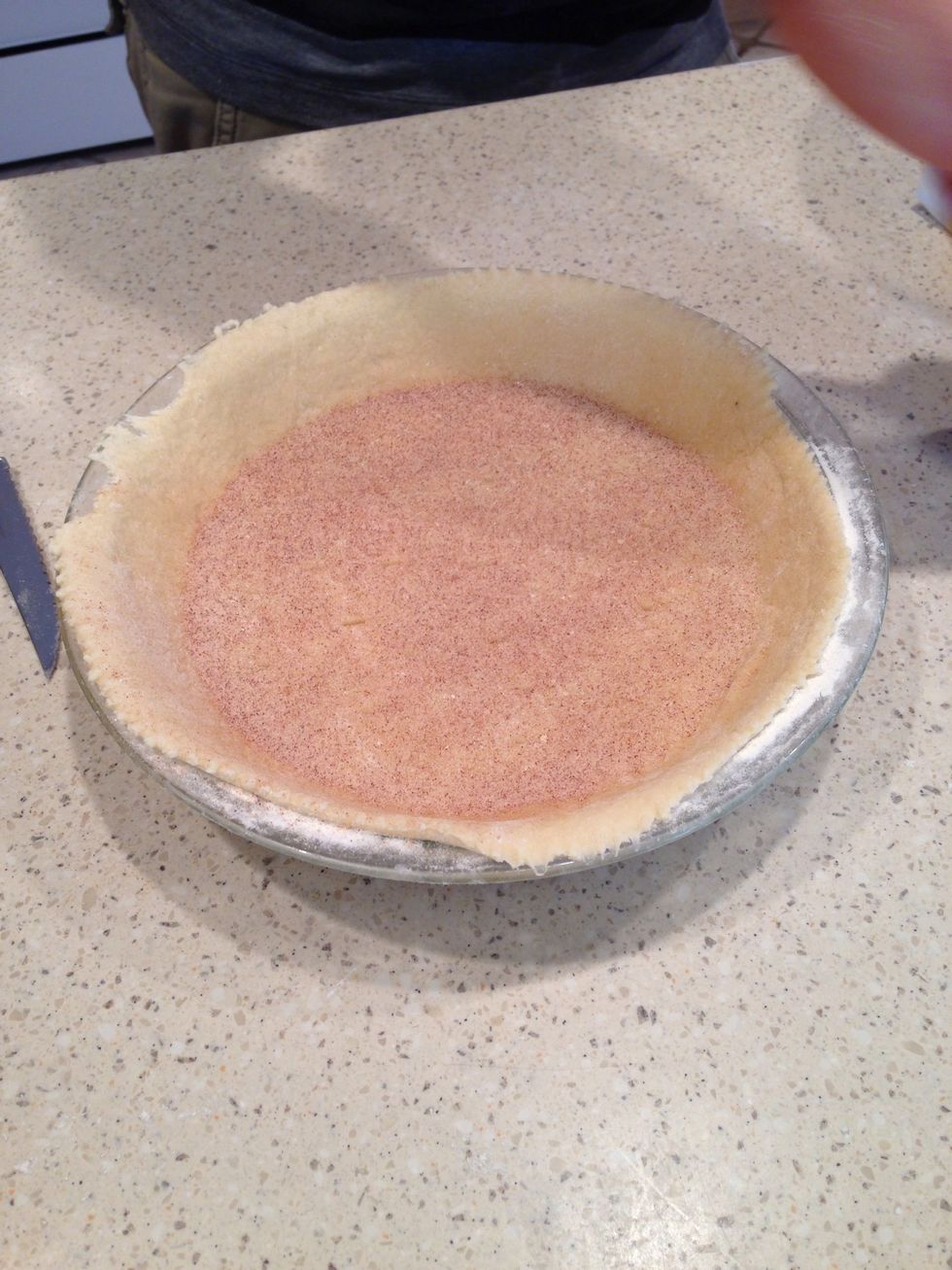 Next, sprinkle enough cinnamon sugar to cover the bottom of the pie
