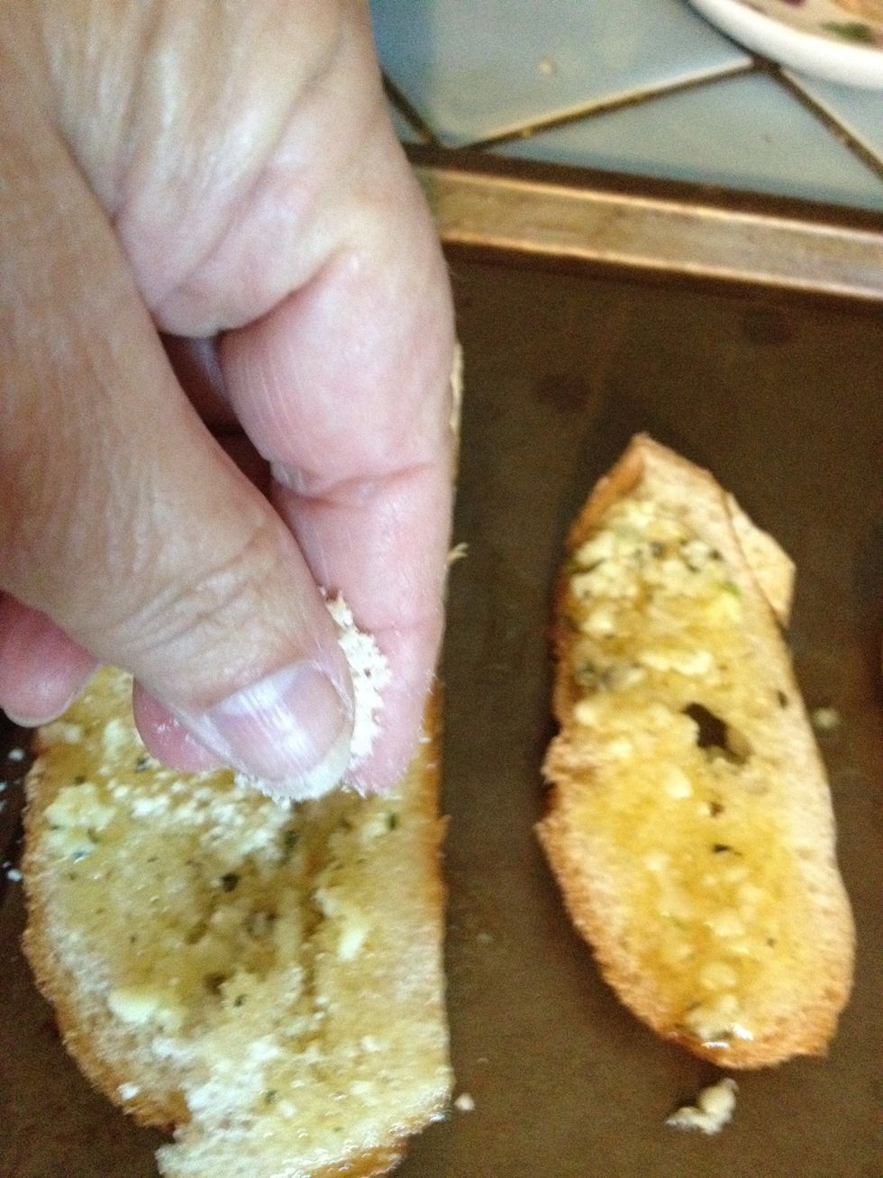 Next sprinkle on the grated Parmesan cheese.