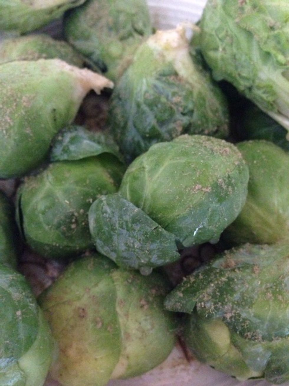 Next, sprinkle sage over your brussels sprouts.