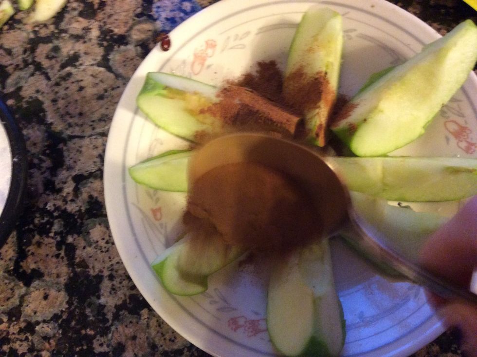 Next sprinkle the cinnamon equally on each apple slice