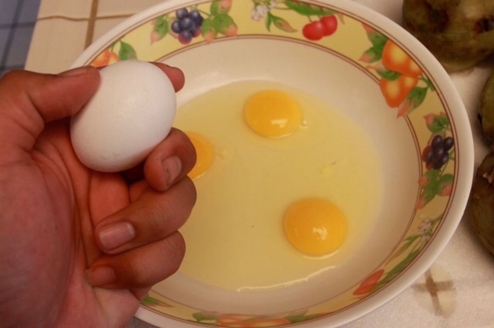 Next start cracking all your eggs and scramble them.