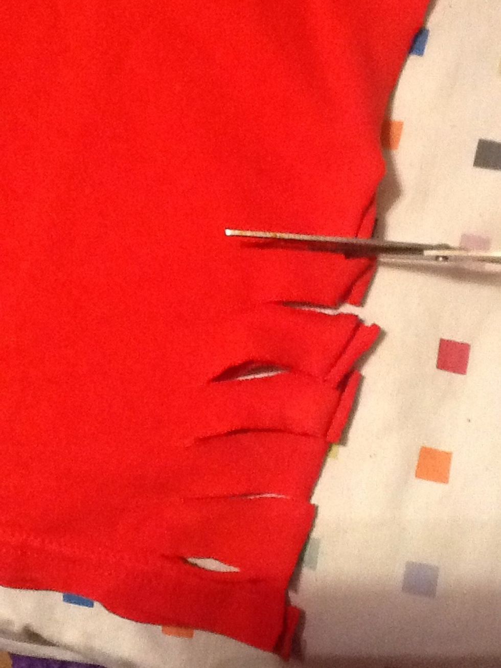 Next, start cutting small tabs. Each tab should be about an inch in size (nuckle).