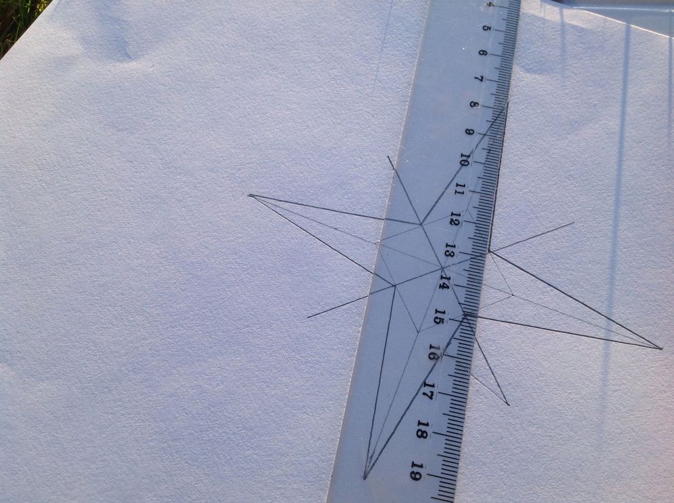 Next step, making the big star!  Use the ruler and make a straight line from the tip of the star to the middle of the square.