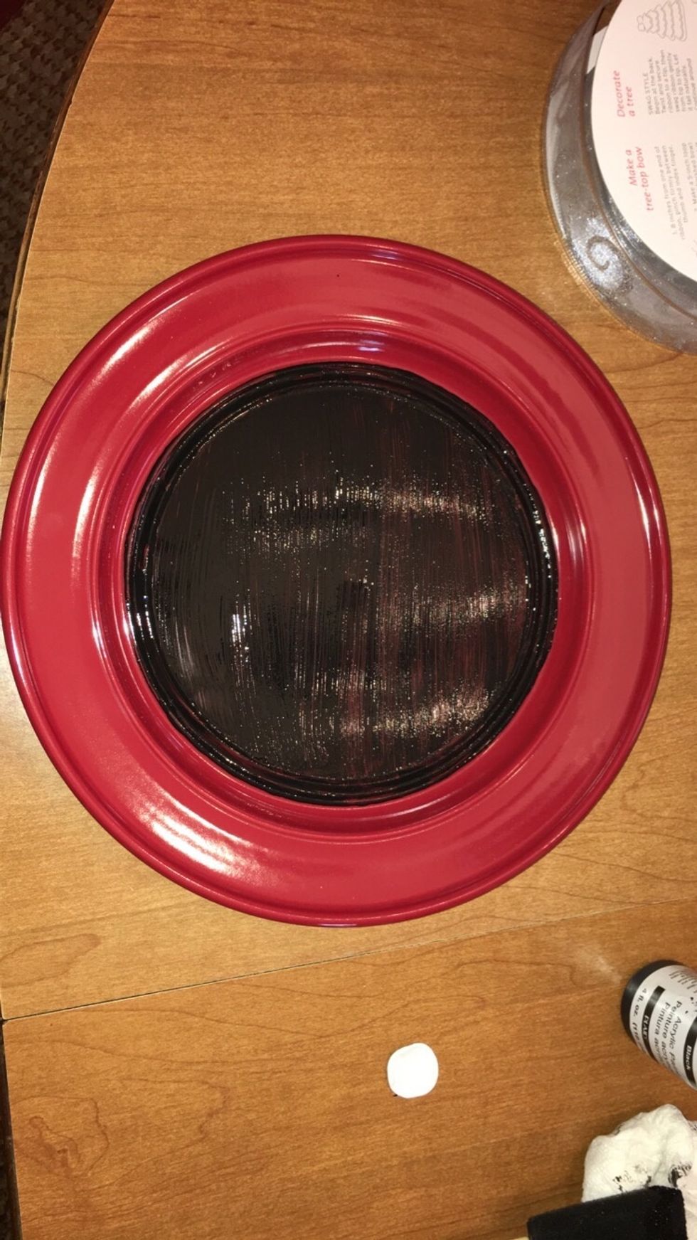 Next step, start painting a thin layer of chalkboard paint onto the inside portion of the plate. Be careful on the edges to not make any rigid lines.