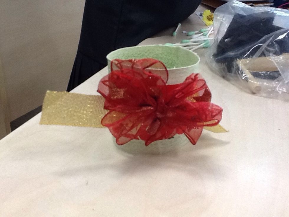 Next,stick a fake flower on it.