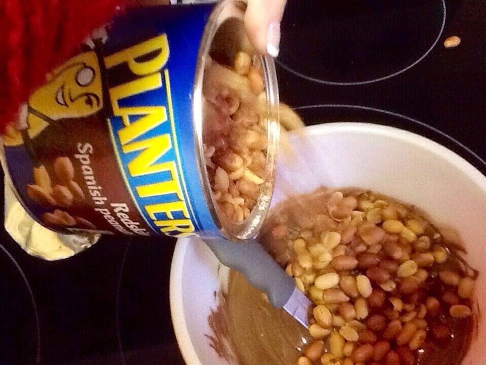 Next, stir in entire can of redskin Spanish peanuts. No other peanuts will do! Mix together until well blended.