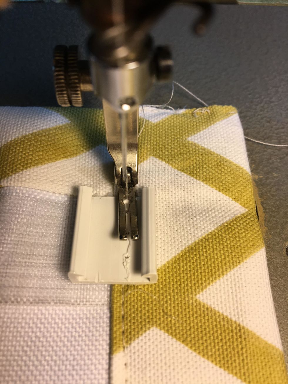 Next, stitch the clips along the top starting your first clip on top of the magnet tape.