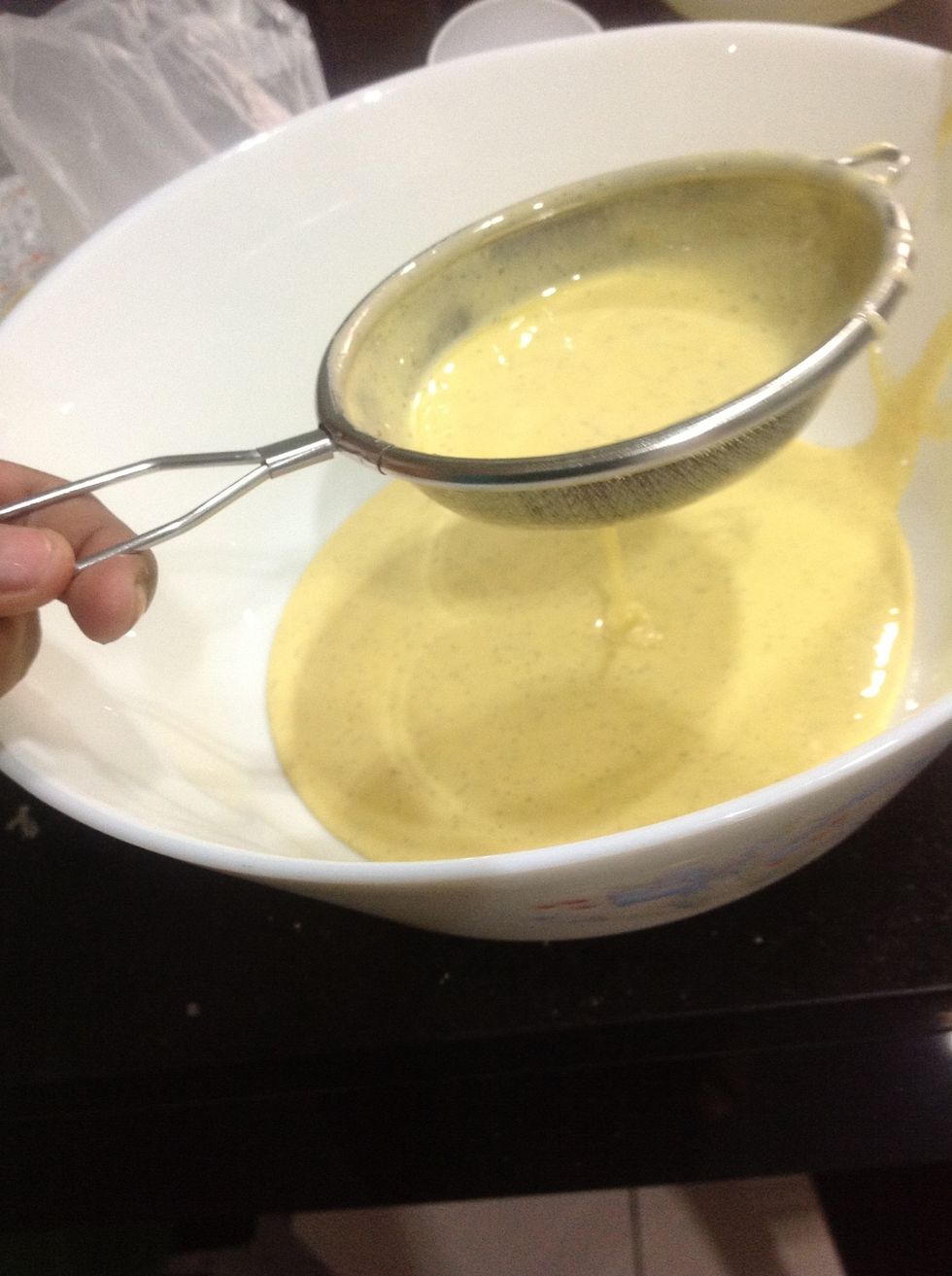 Next, strain the mixture in case there were any 'cooked' eggs. I used my finest sieve to ensure I get a really creamy, smooth ice cream. \ud83d\ude0a